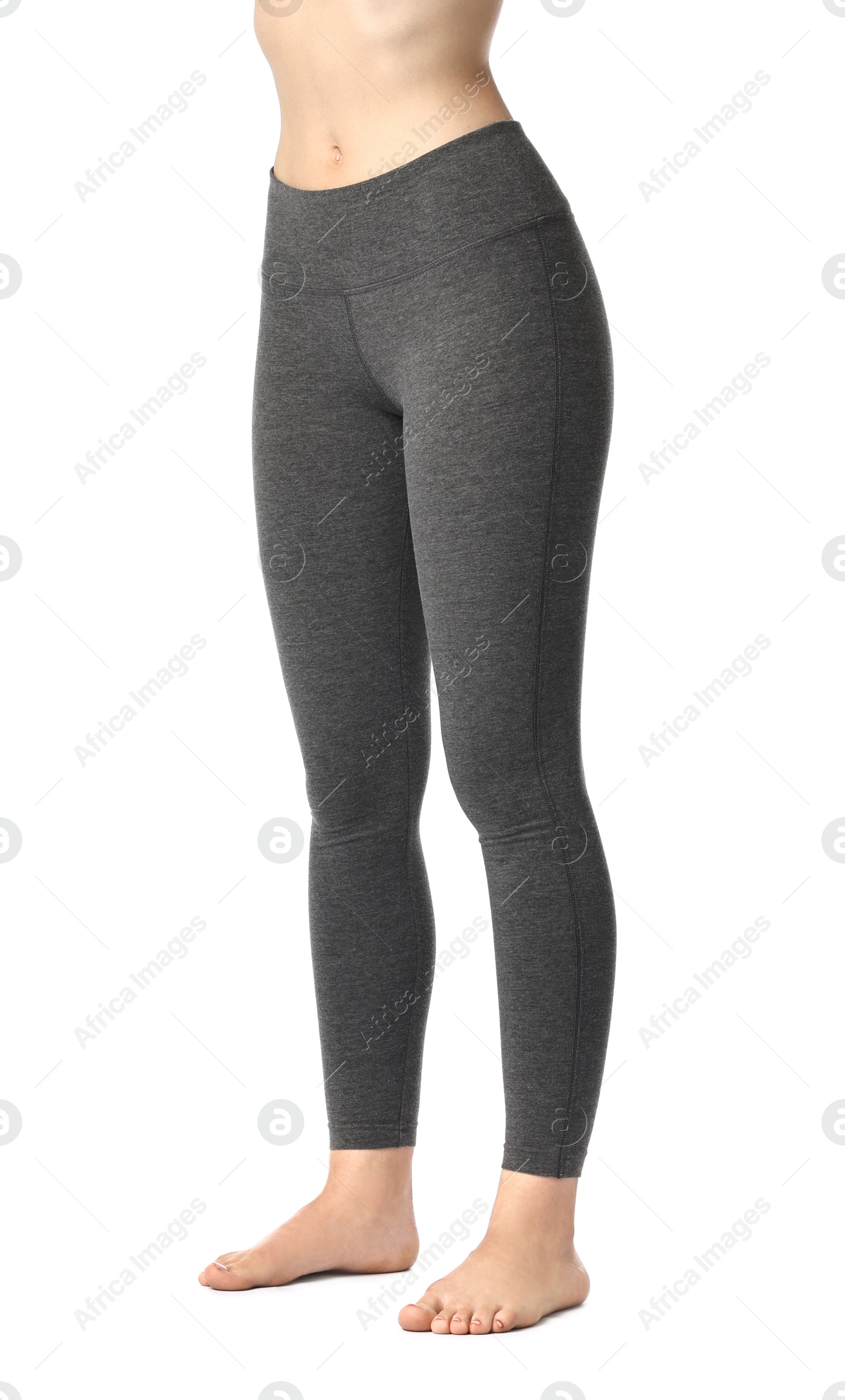 Photo of Woman wearing sports leggings on white background, closeup