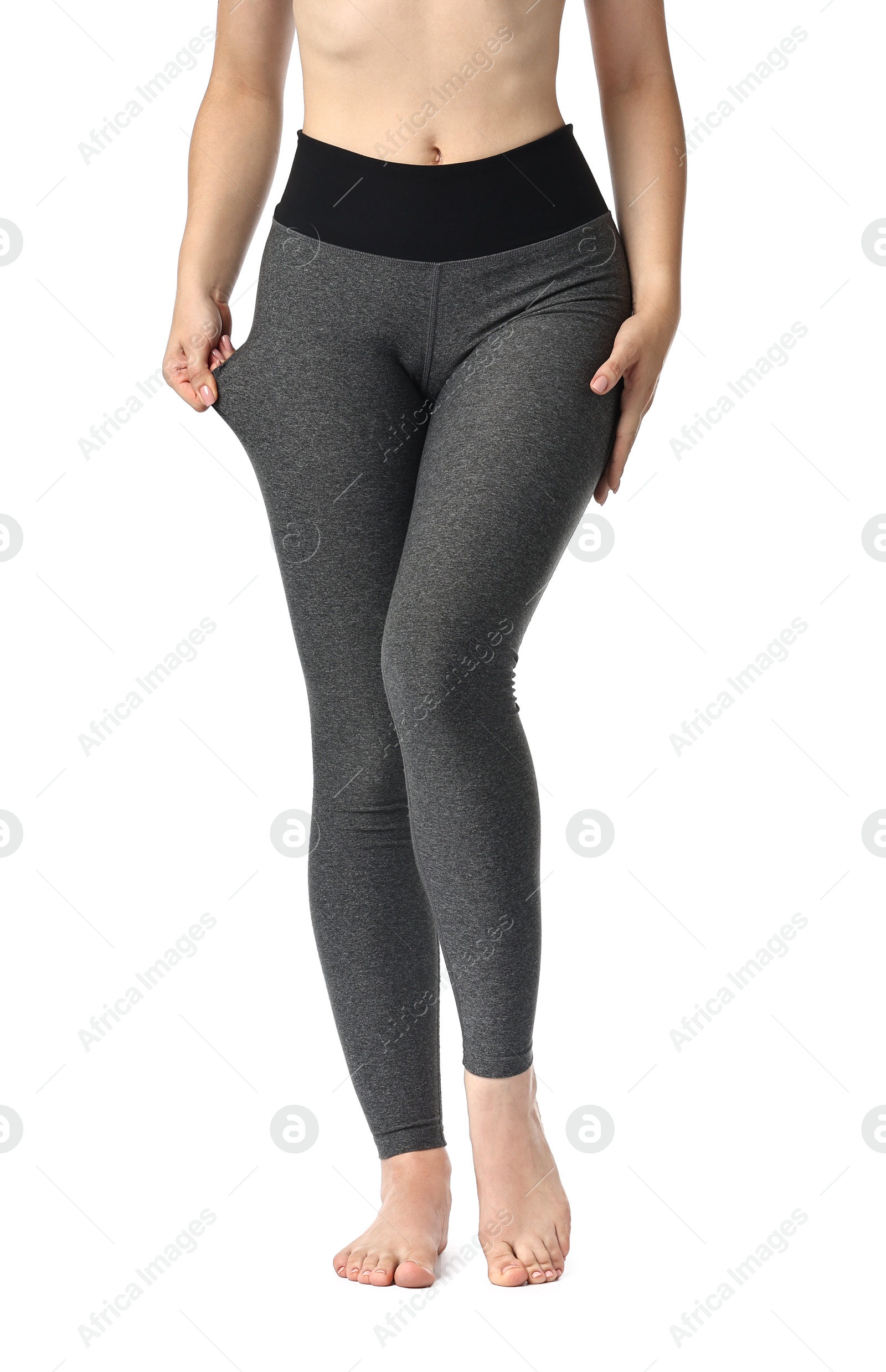 Photo of Woman wearing sports leggings on white background, closeup