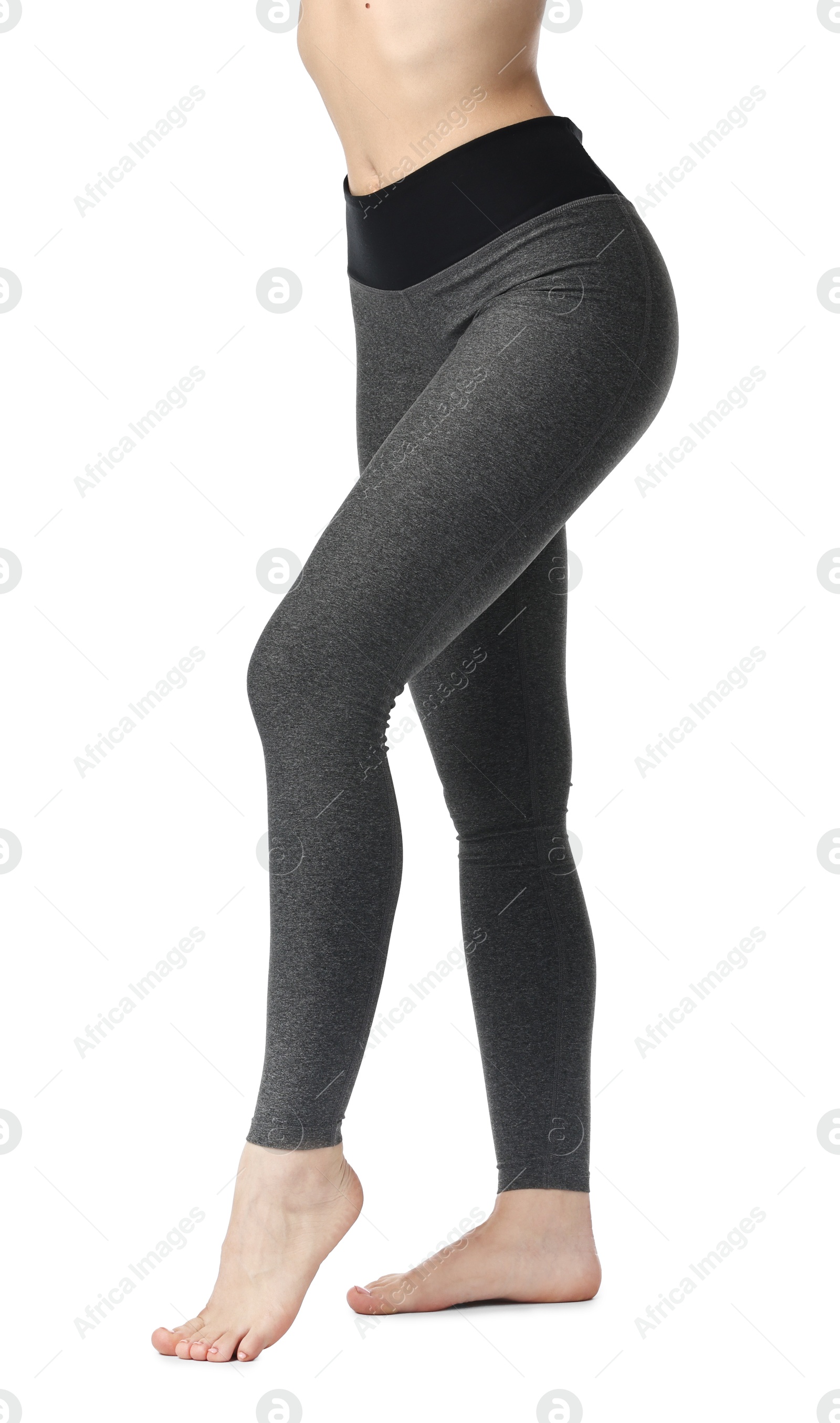 Photo of Woman wearing sports leggings on white background, closeup