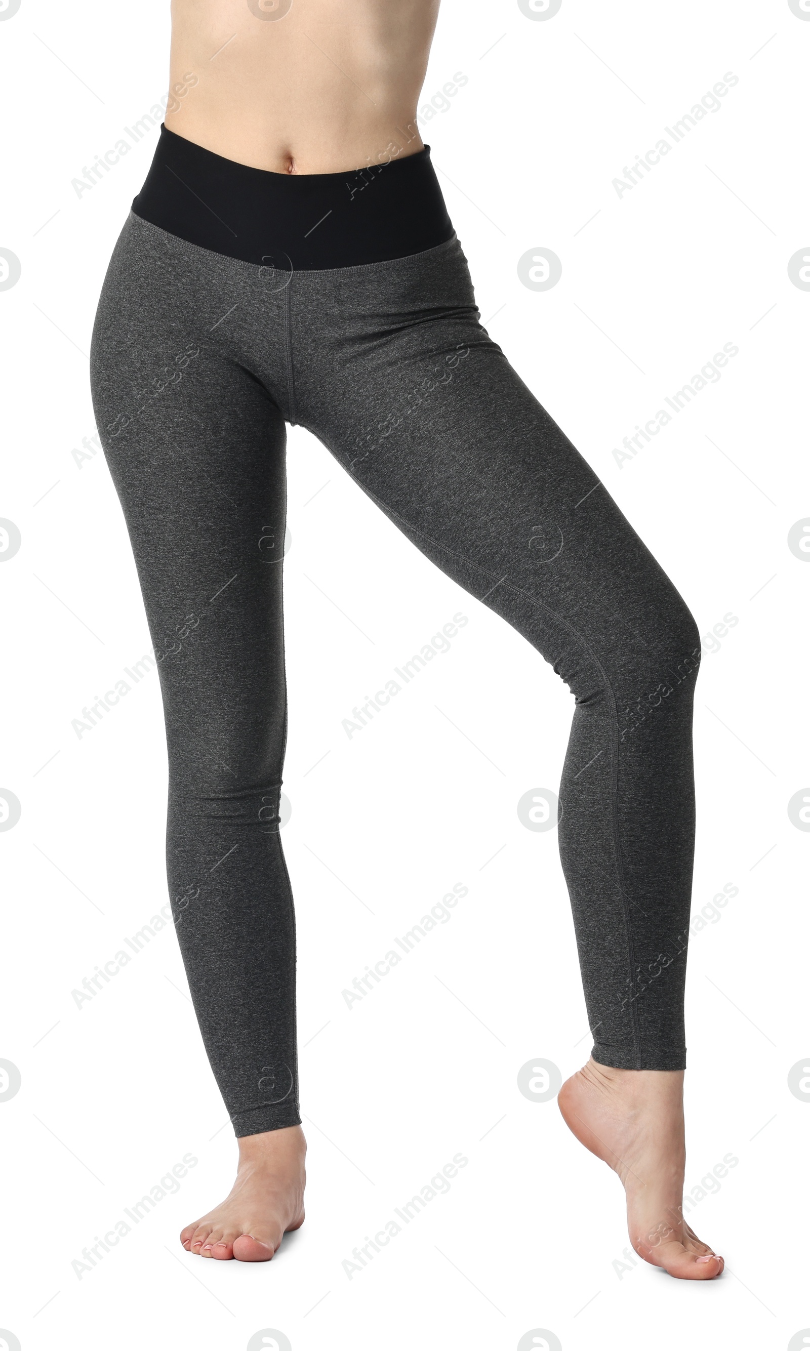 Photo of Woman wearing sports leggings on white background, closeup