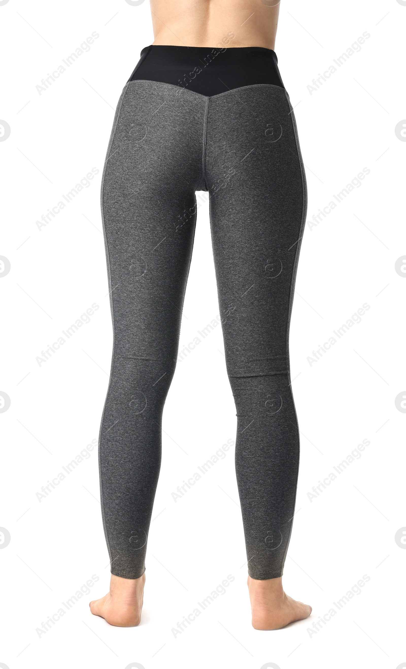 Photo of Woman wearing sports leggings on white background, closeup