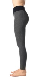 Photo of Woman wearing sports leggings on white background, closeup