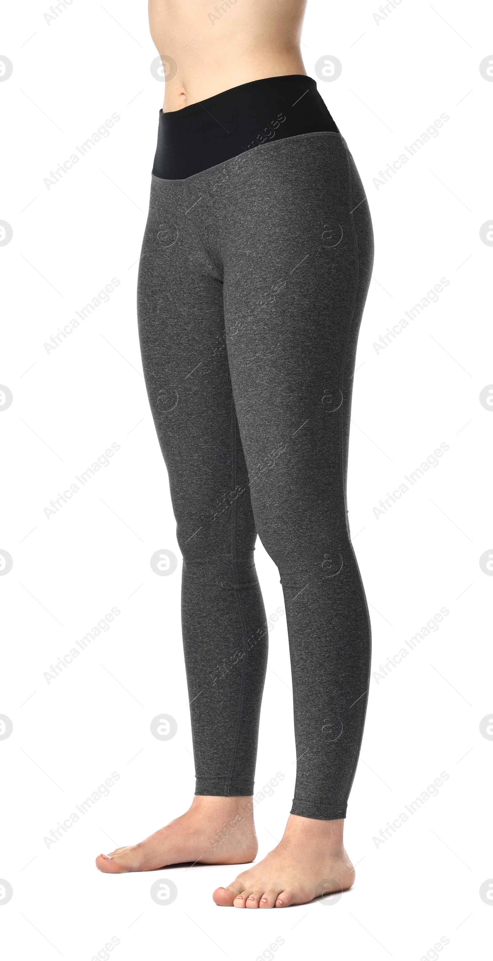 Photo of Woman wearing sports leggings on white background, closeup