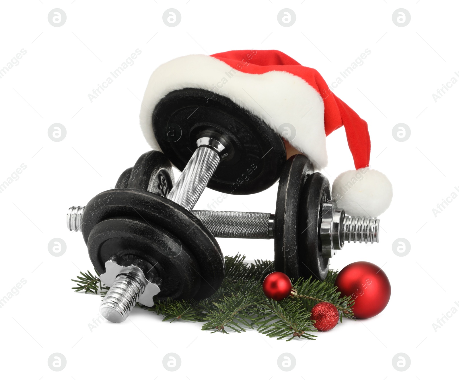 Photo of Dumbbells and Christmas decor isolated on white