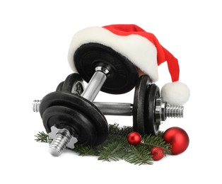 Photo of Dumbbells and Christmas decor isolated on white