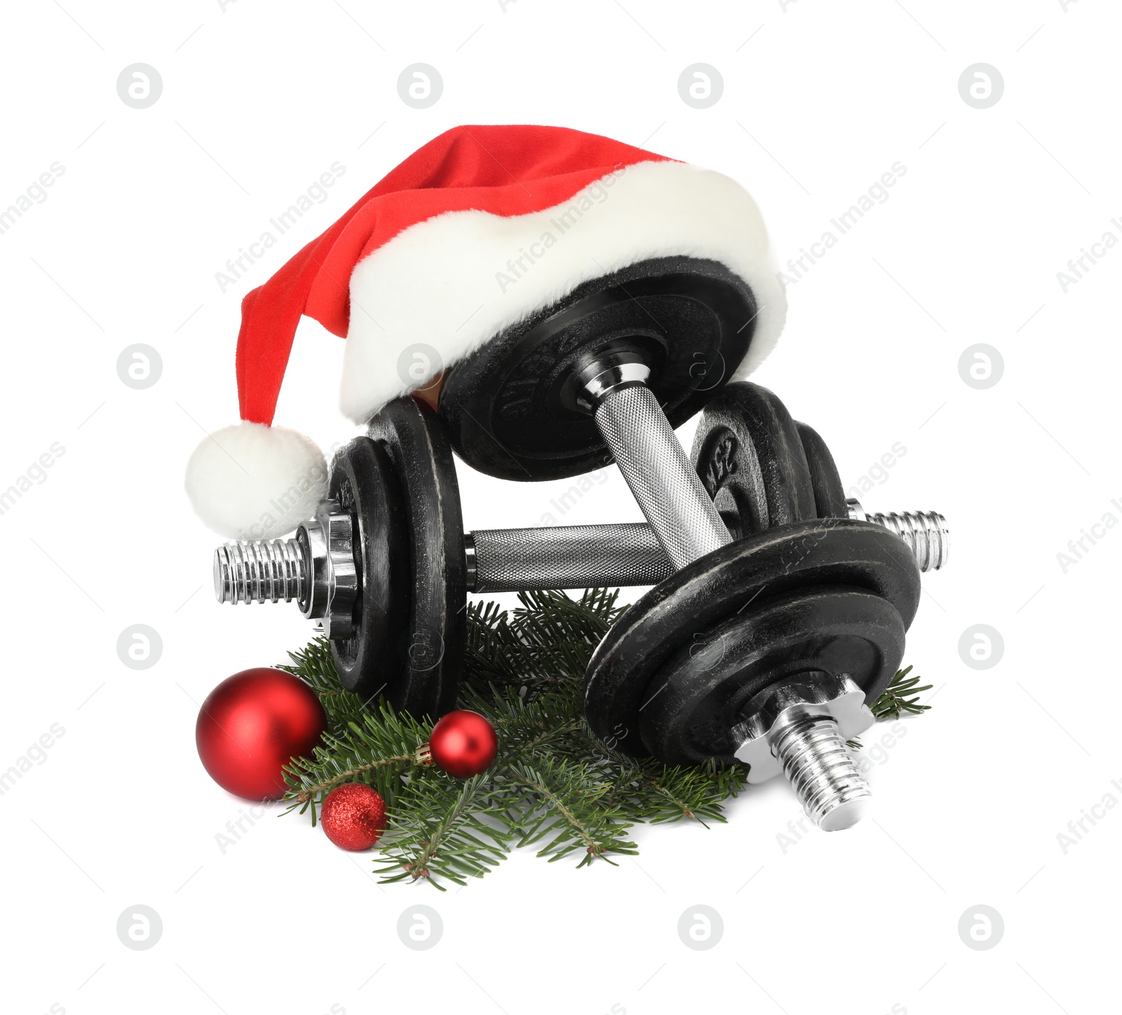 Photo of Dumbbells and Christmas decor isolated on white