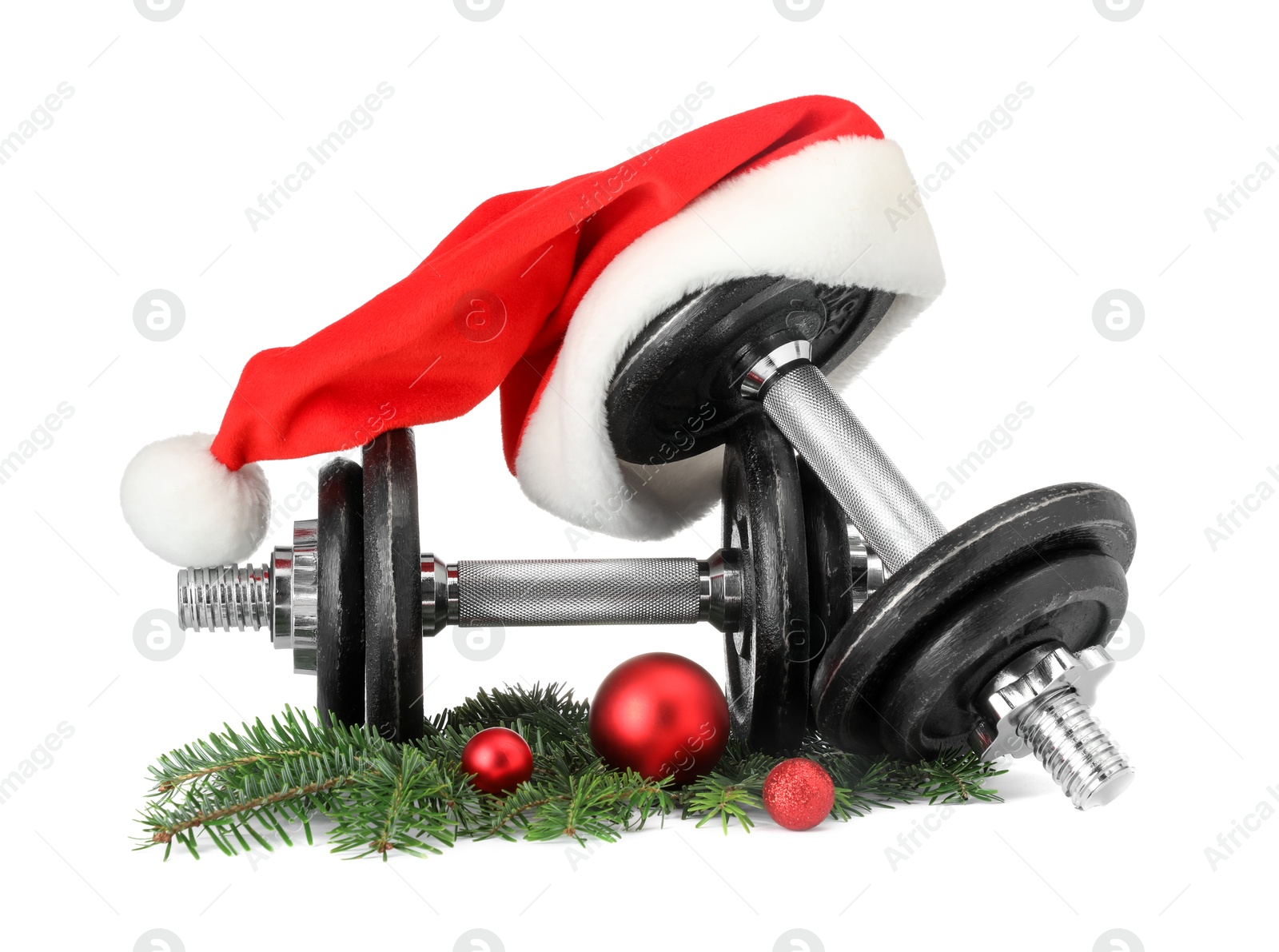 Photo of Dumbbells and Christmas decor isolated on white