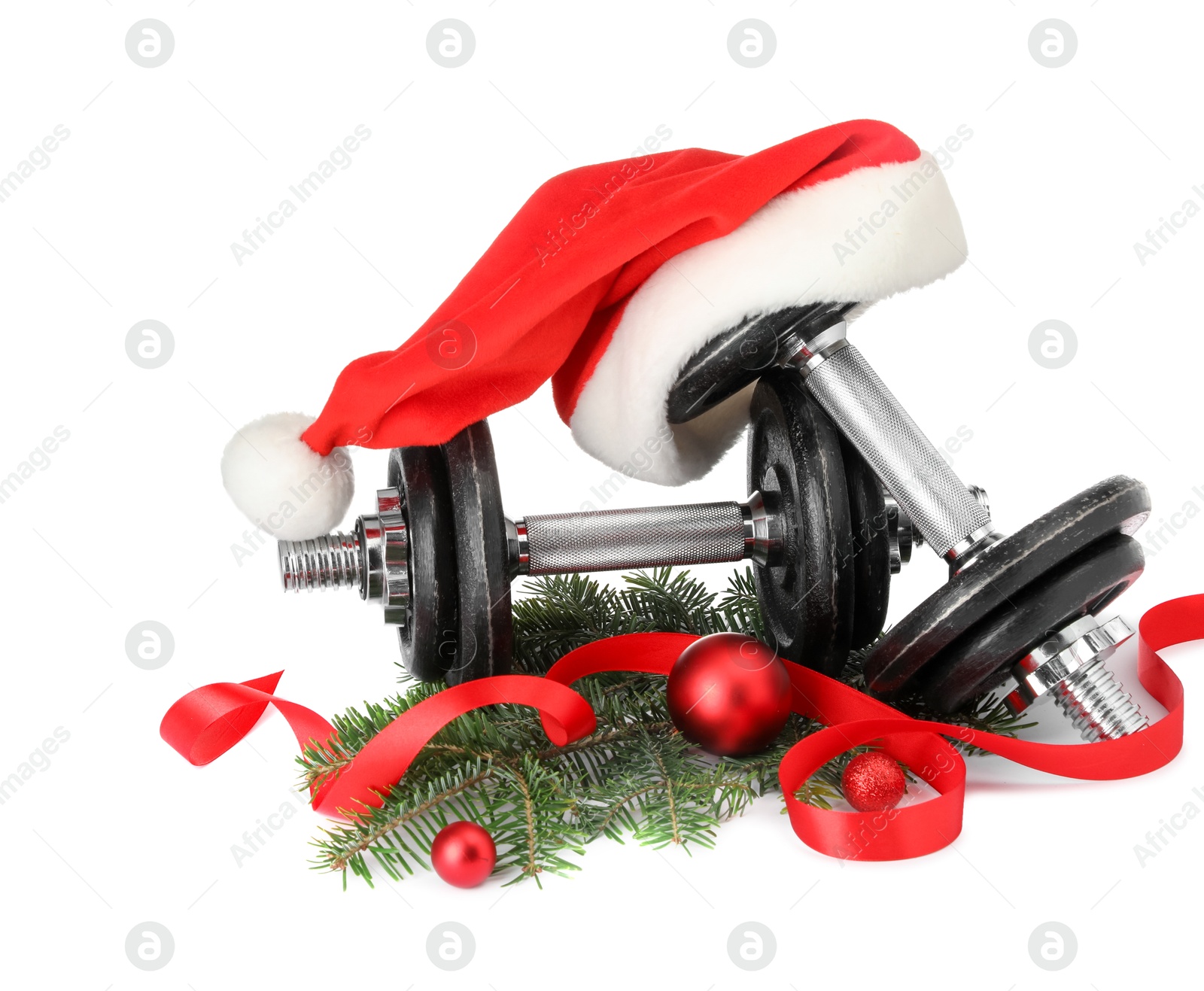 Photo of Dumbbells and Christmas decor isolated on white