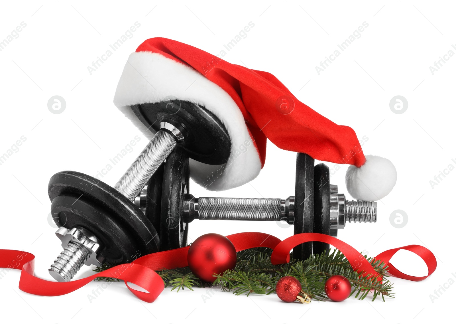 Photo of Dumbbells and Christmas decor isolated on white