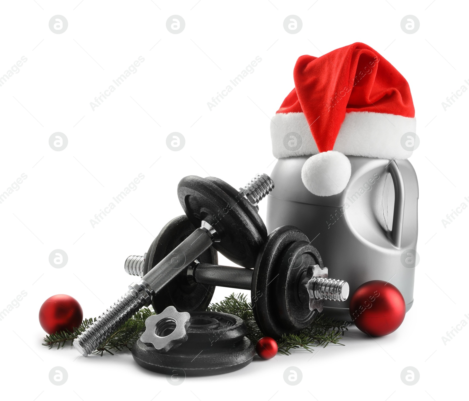 Photo of Dumbbells, container with supplement and Christmas decor isolated on white