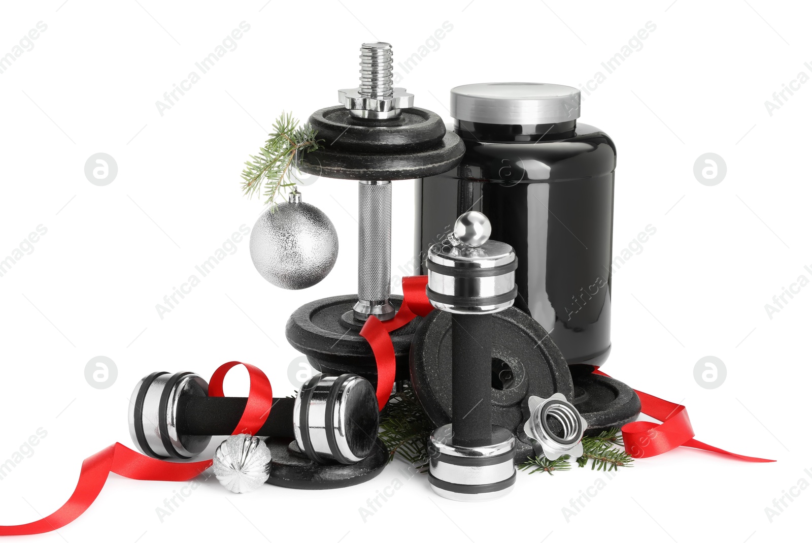 Photo of Dumbbells, container with supplement and Christmas decor isolated on white