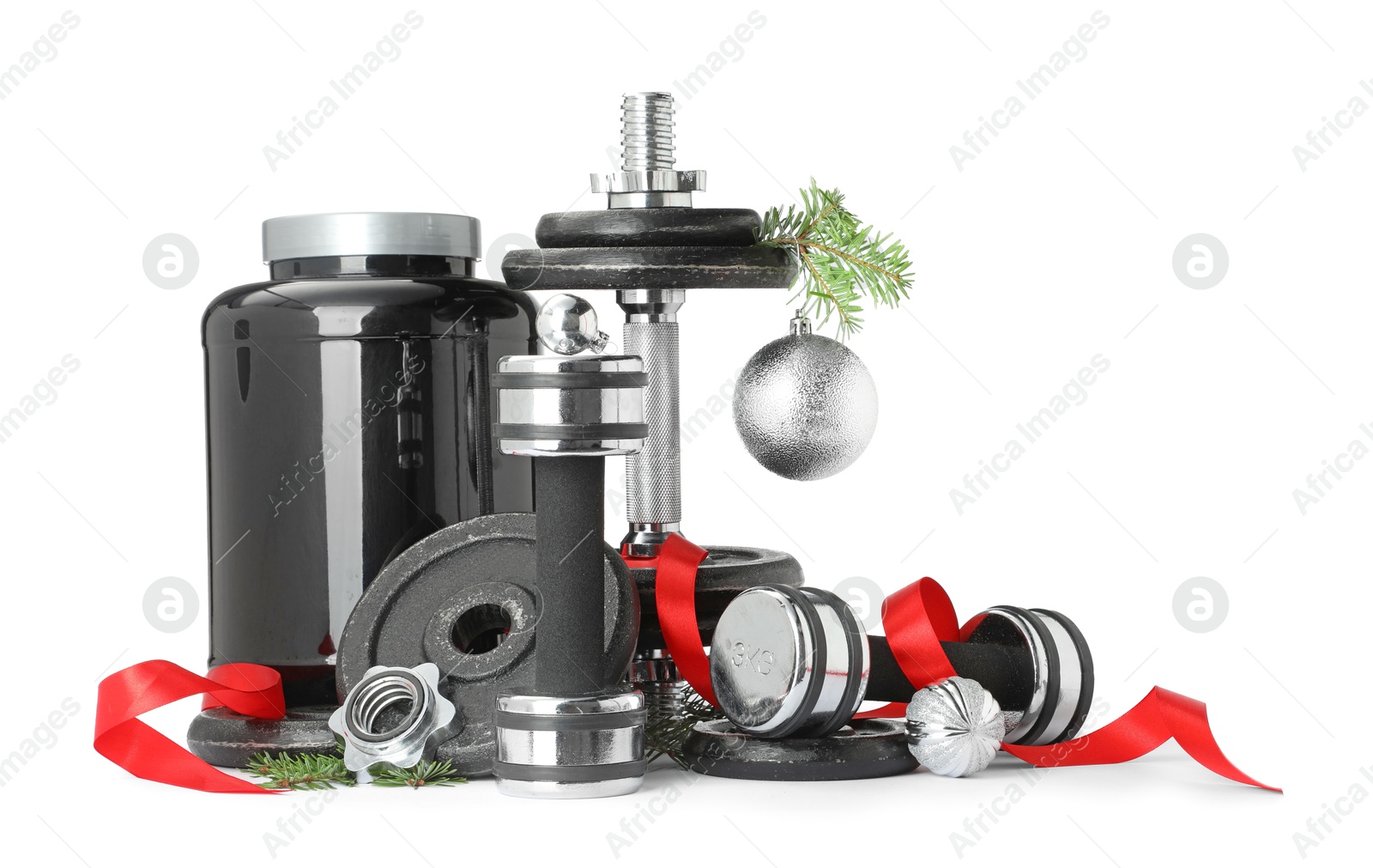 Photo of Dumbbells, container with supplement and Christmas decor isolated on white