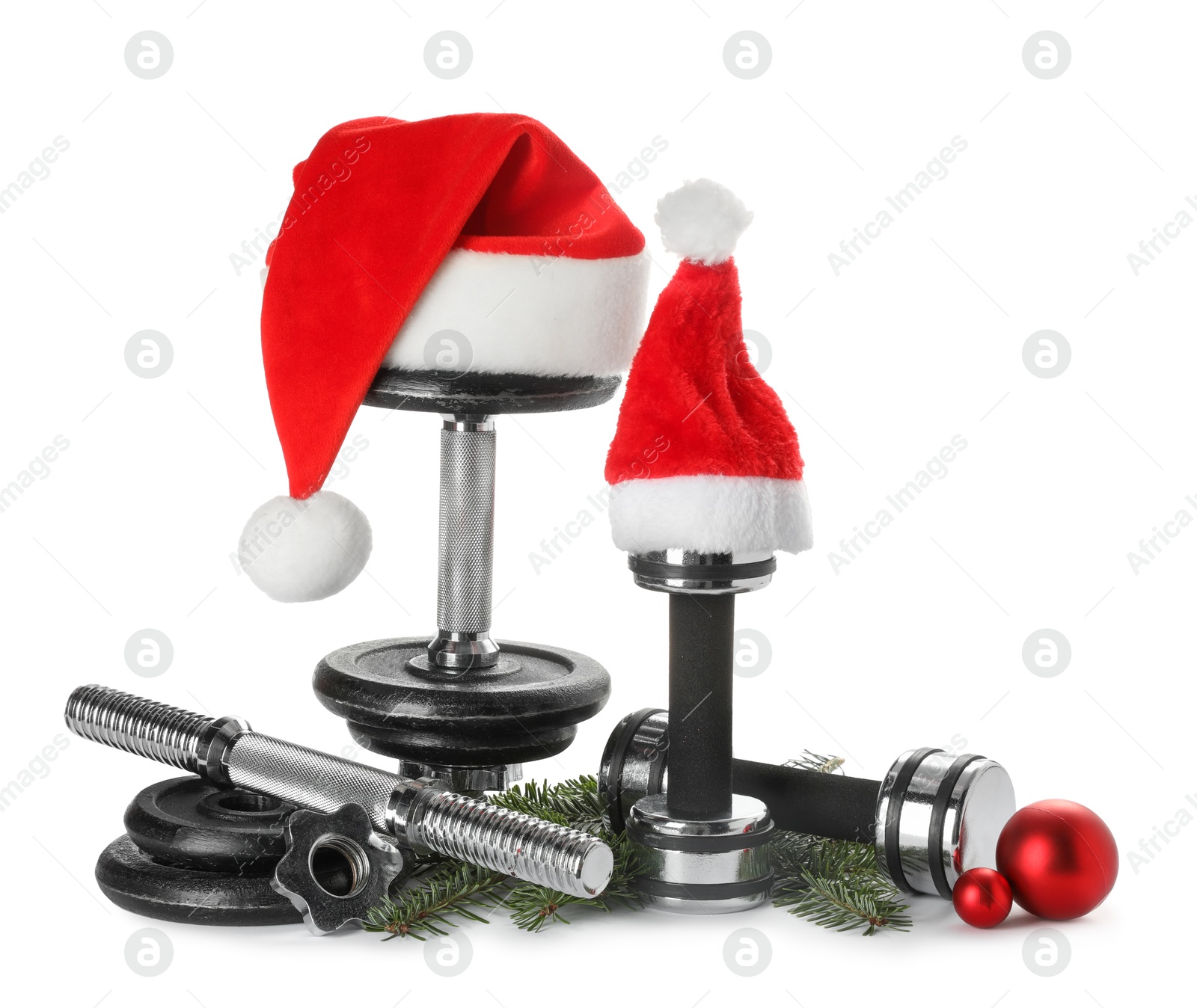 Photo of Dumbbells and Christmas decor isolated on white