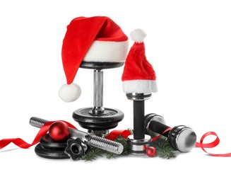 Photo of Dumbbells and Christmas decor isolated on white