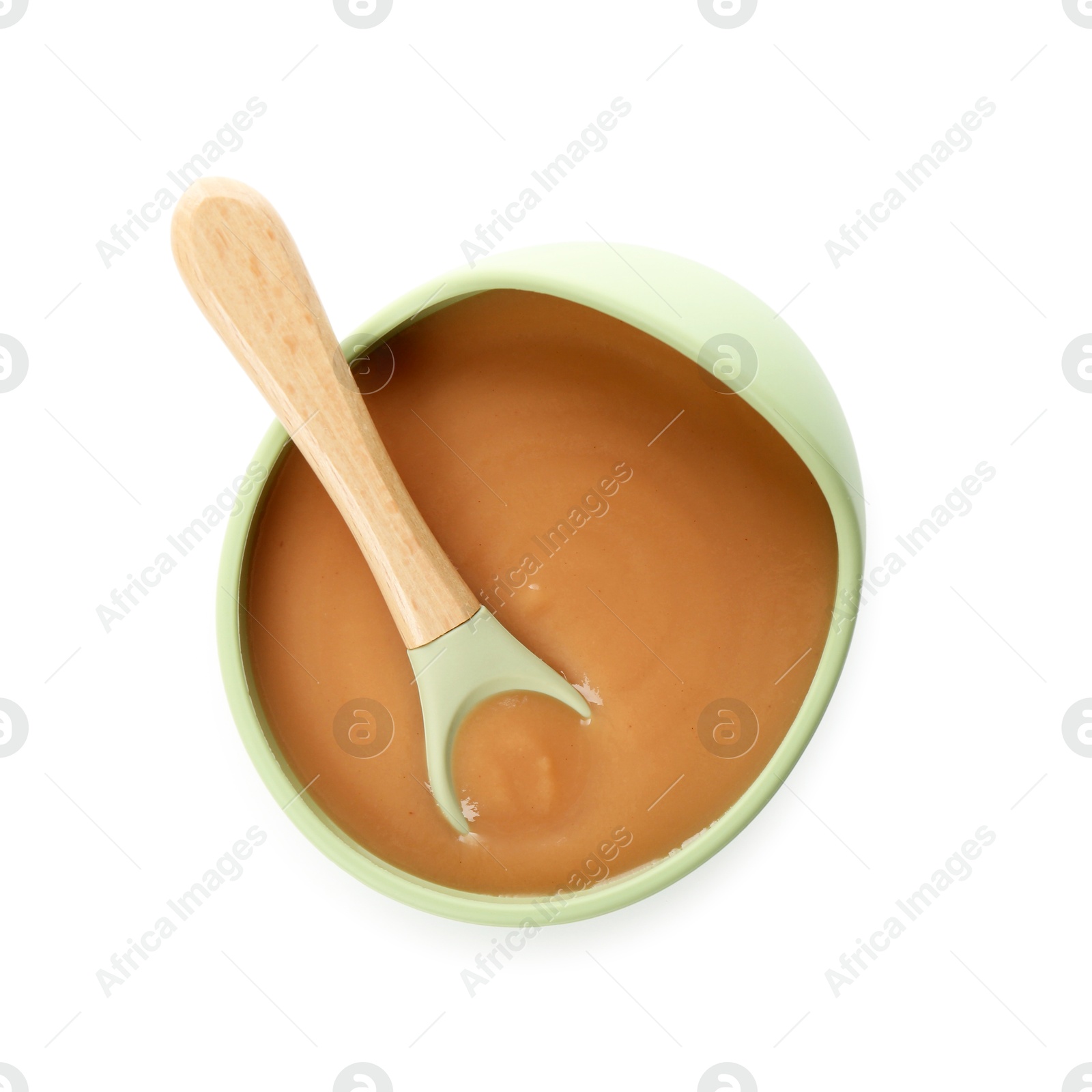 Photo of Delicious baby food in bowl and spoon isolated on white, top view