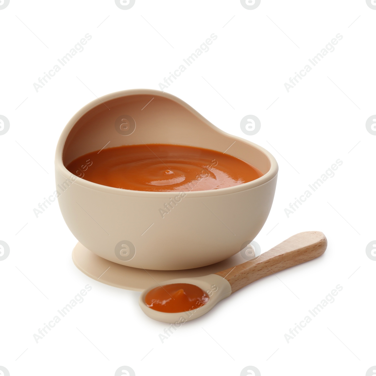 Photo of Delicious baby food in bowl and spoon isolated on white