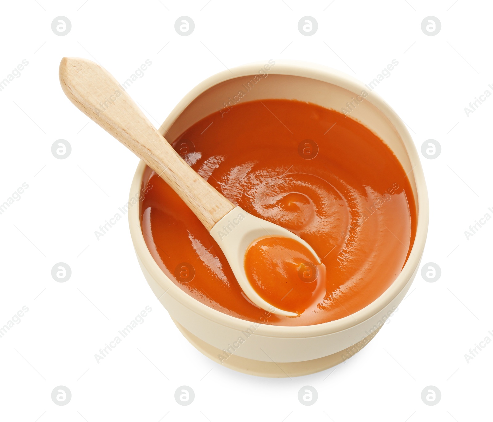 Photo of Delicious baby food in bowl and spoon isolated on white