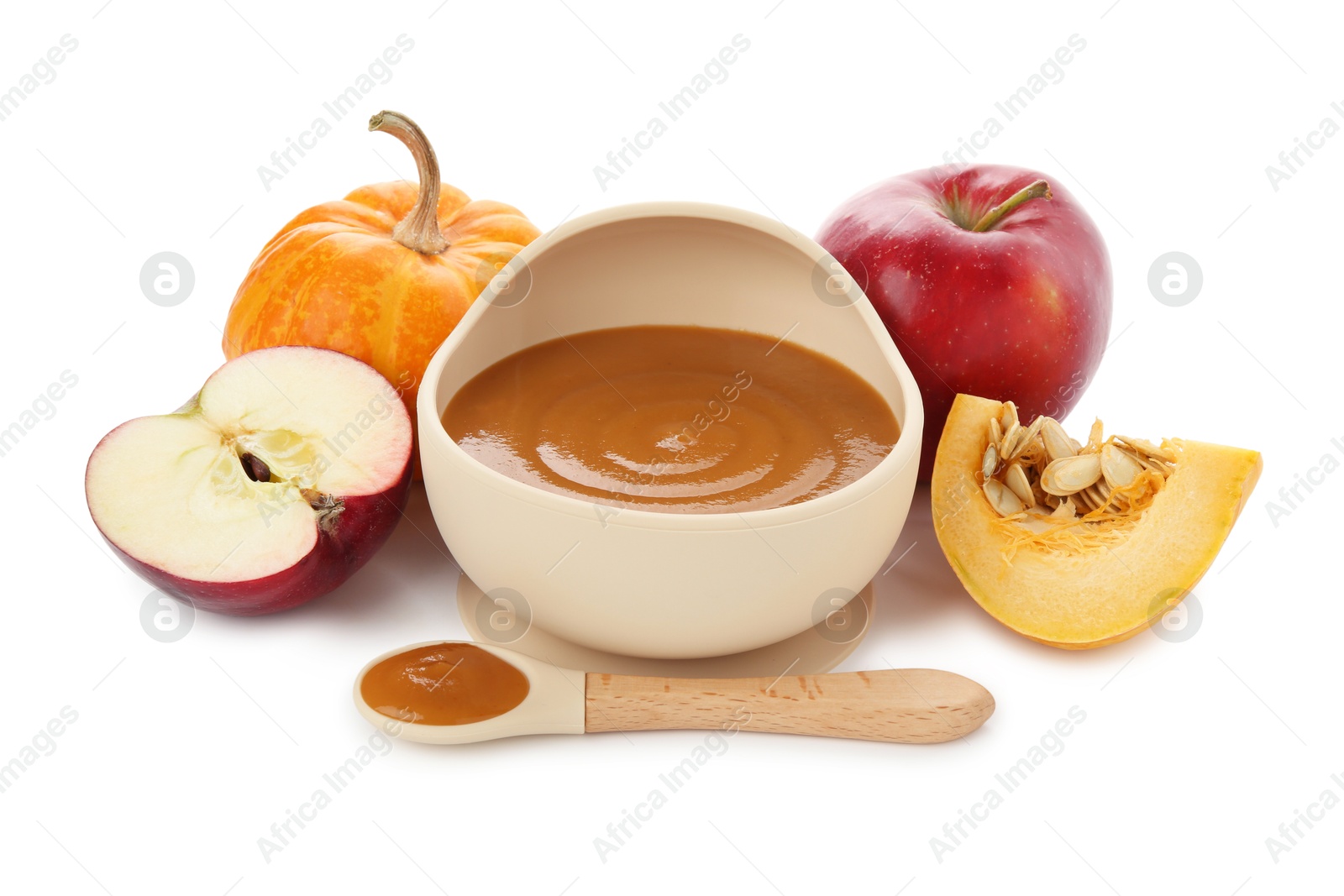 Photo of Delicious baby food in bowl with spoon and fresh ingredients isolated on white