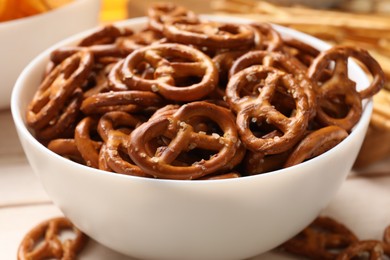 Photo of Delicious salty pretzel crackers on table, closeup