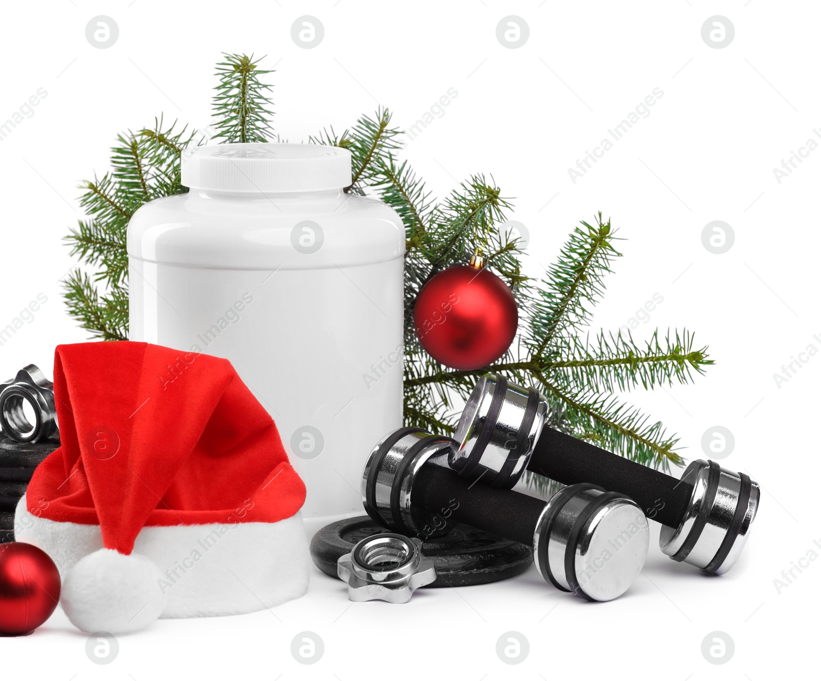 Photo of Dumbbells, container with supplement and Christmas decor isolated on white