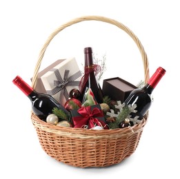 Photo of Wicker gift basket with sparkling wine isolated on white