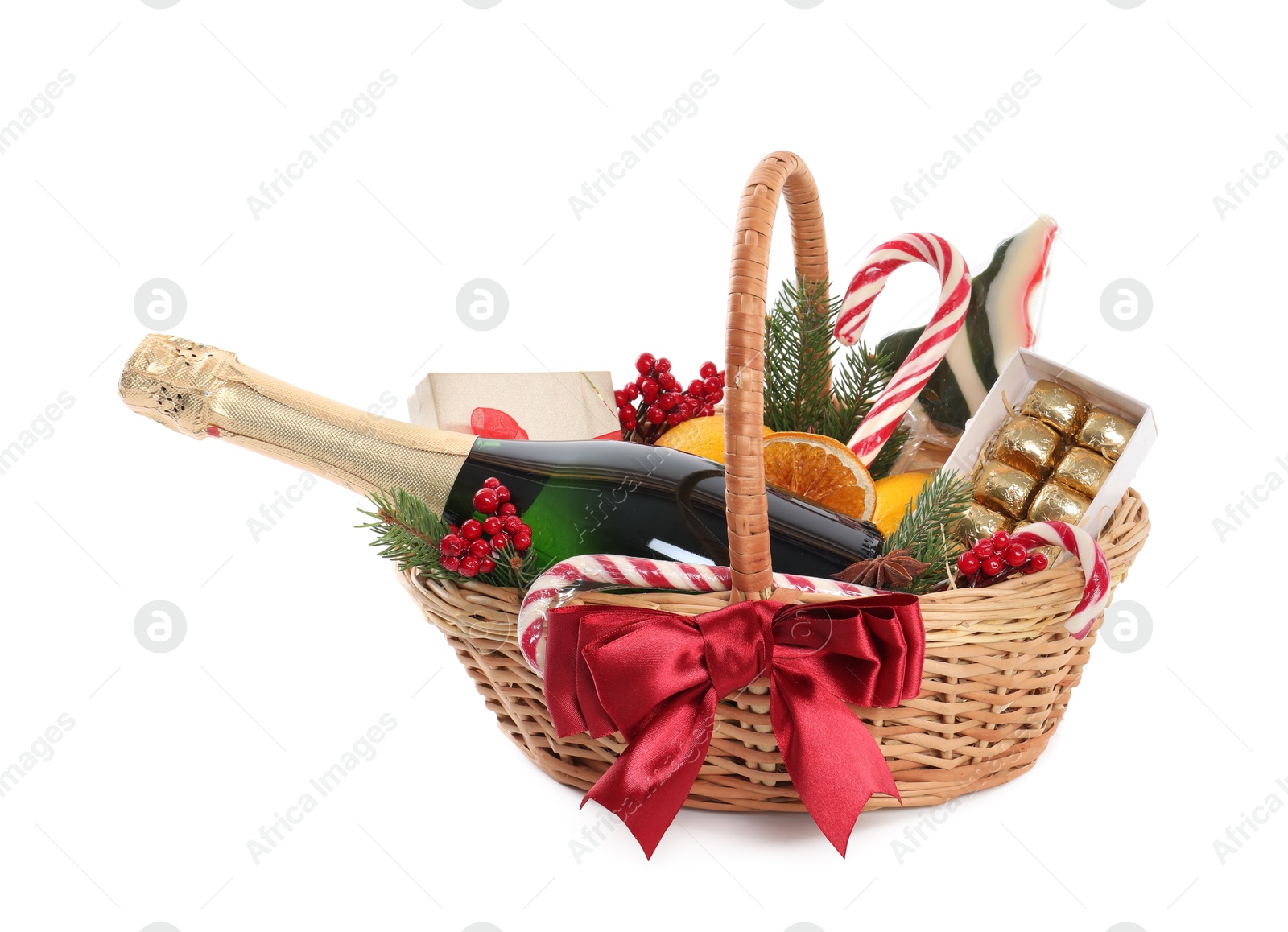 Photo of Wicker gift basket with sparkling wine isolated on white