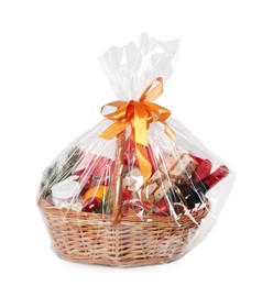 Photo of Wicker gift basket with sparkling wine isolated on white