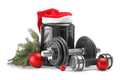 Photo of Dumbbells, container with supplement and Christmas decor isolated on white