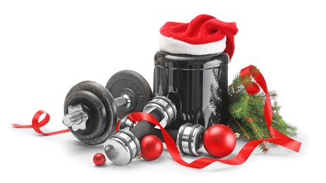 Photo of Dumbbells, container with supplement and Christmas decor isolated on white