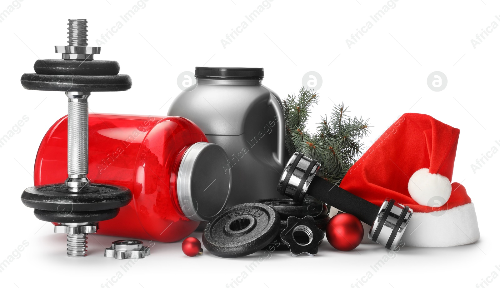 Photo of Dumbbells, containers with supplement and Christmas decor isolated on white