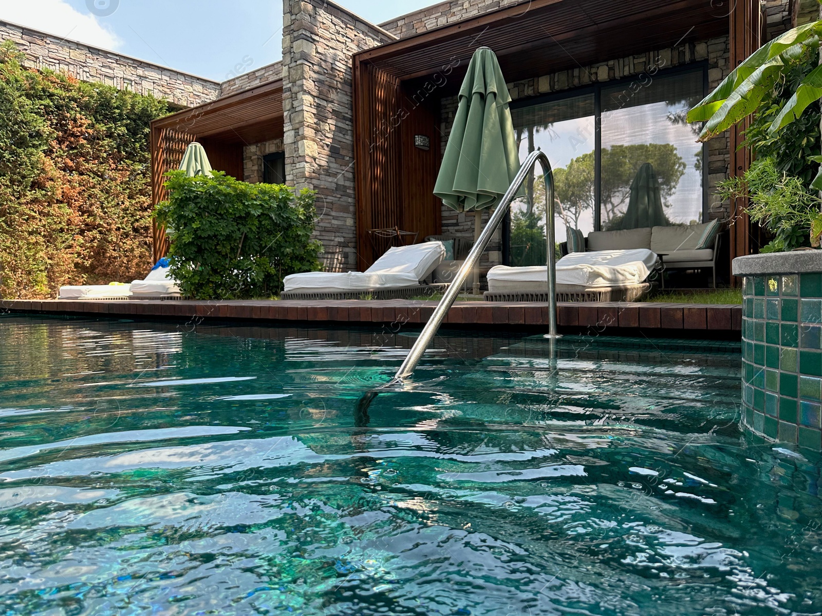 Photo of Outdoor swimming pool with clear water at luxury resort