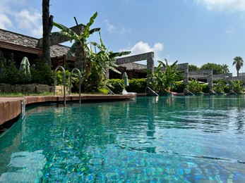 Outdoor swimming pool with clear water at luxury resort