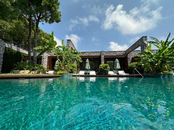 Outdoor swimming pool with clear water at luxury resort