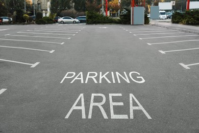 Image of Empty outdoor parking lot with painted markings on asphalt