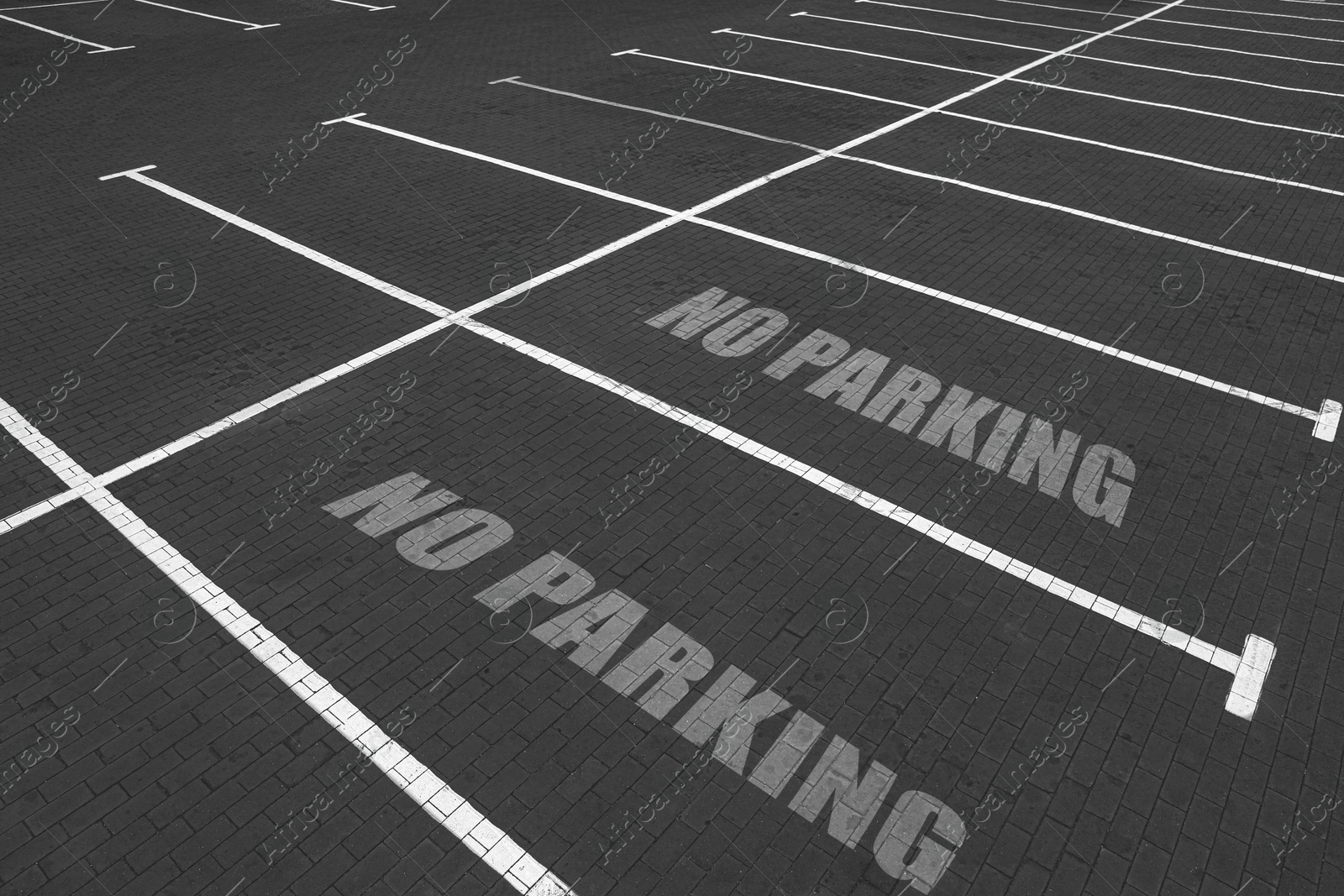 Image of Empty outdoor parking lot with painted markings on asphalt