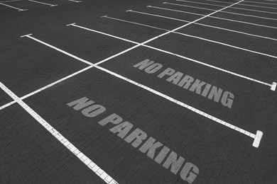 Image of Empty outdoor parking lot with painted markings on asphalt