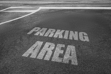 Empty outdoor parking lot with painted markings on asphalt