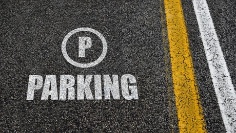 Image of Sign of parking lot painted on asphalt