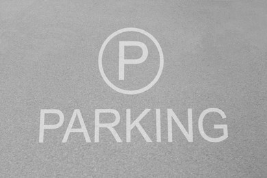 Sign of parking lot painted on asphalt, top view