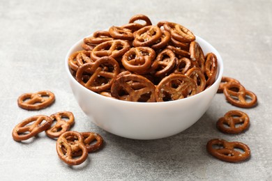 Photo of Delicious pretzel crackers on light table, closeup