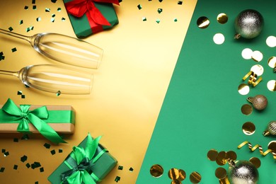 Photo of Flat lay composition with confetti and gift boxes on color background, space for text. Christmas decor