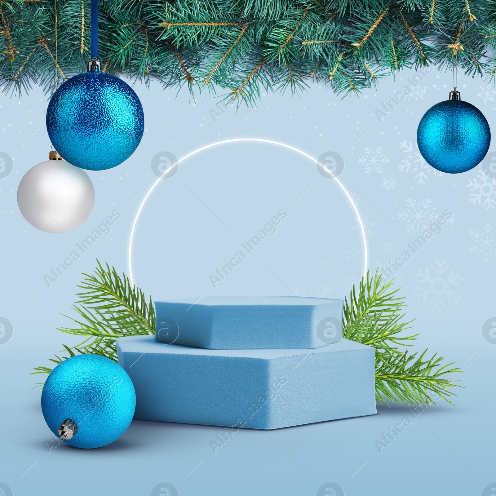 Image of Stage for stylish presentation with Christmas balls, snowflakes, empty podium and fir tree branches on light blue background. Poster or sale flyer design