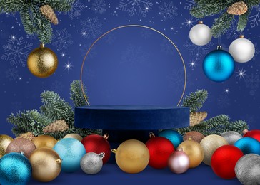 Image of Stage for stylish presentation with Christmas balls, snowflakes, empty podium and fir tree branches on blue background. Poster or sale flyer design