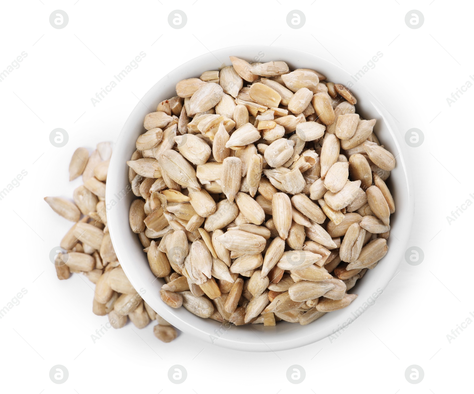 Photo of Peeled sunflower seeds in bowl isolated on white, top view