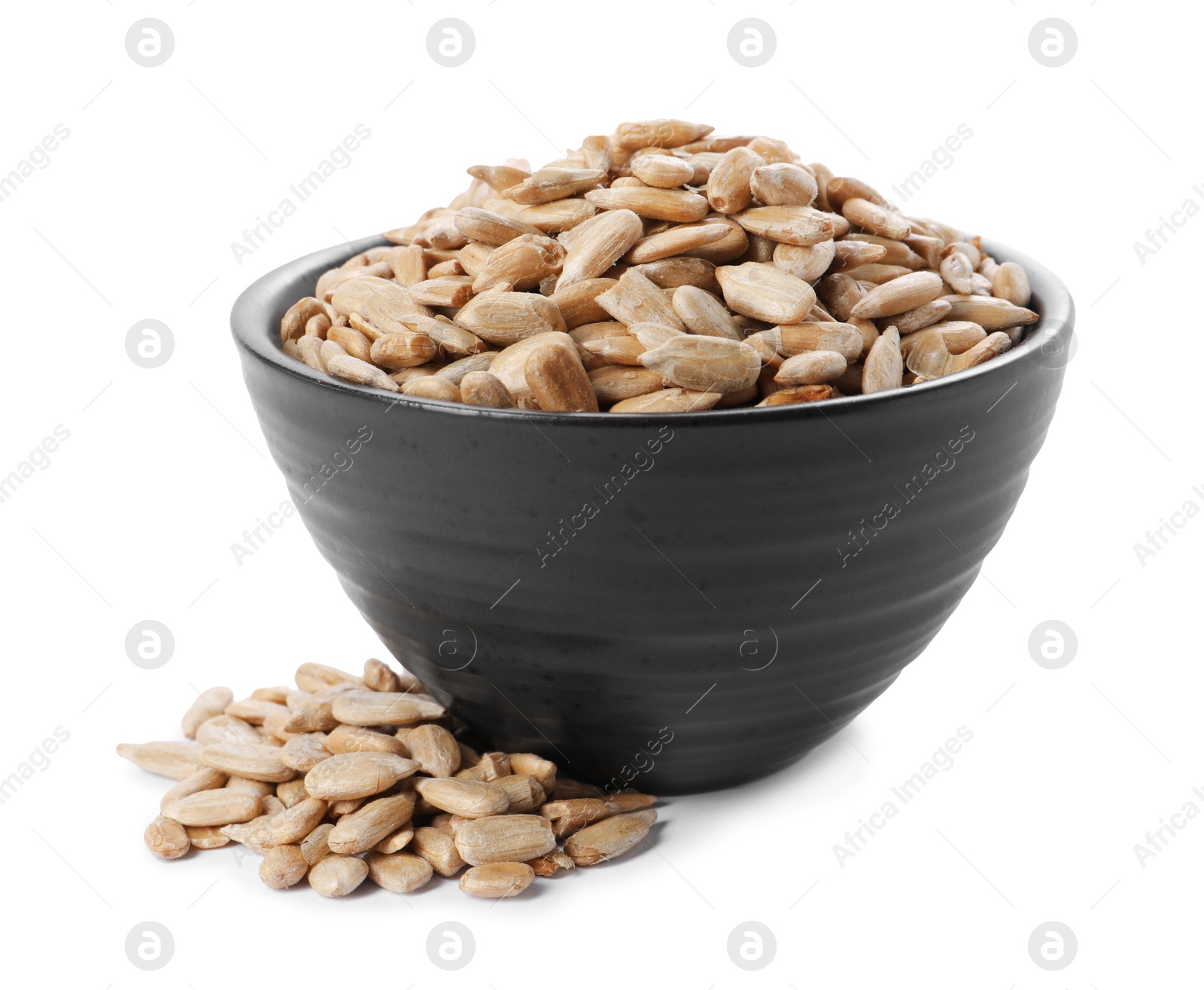 Photo of Peeled sunflower seeds in bowl isolated on white