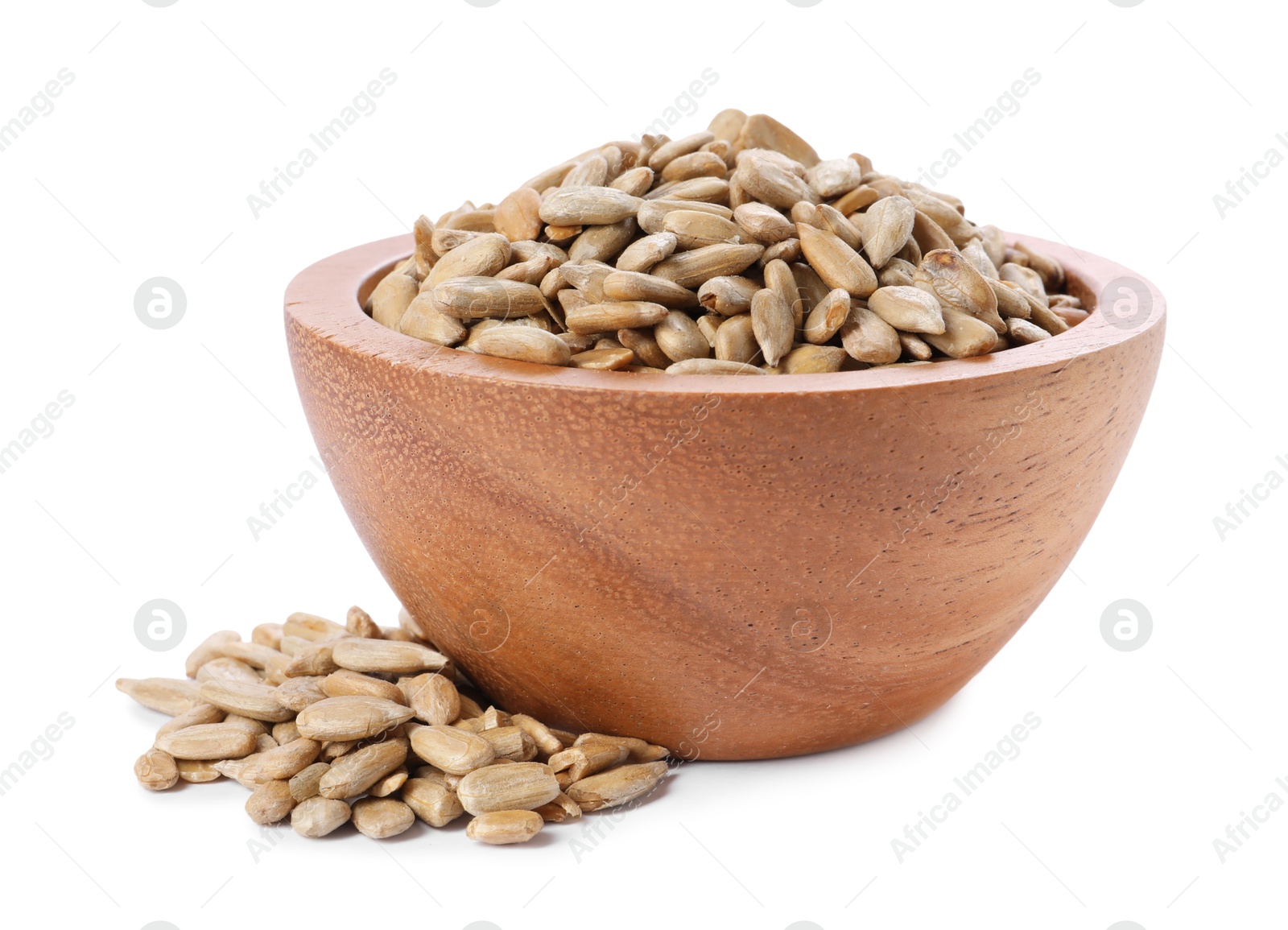 Photo of Peeled sunflower seeds in wooden bowl isolated on white