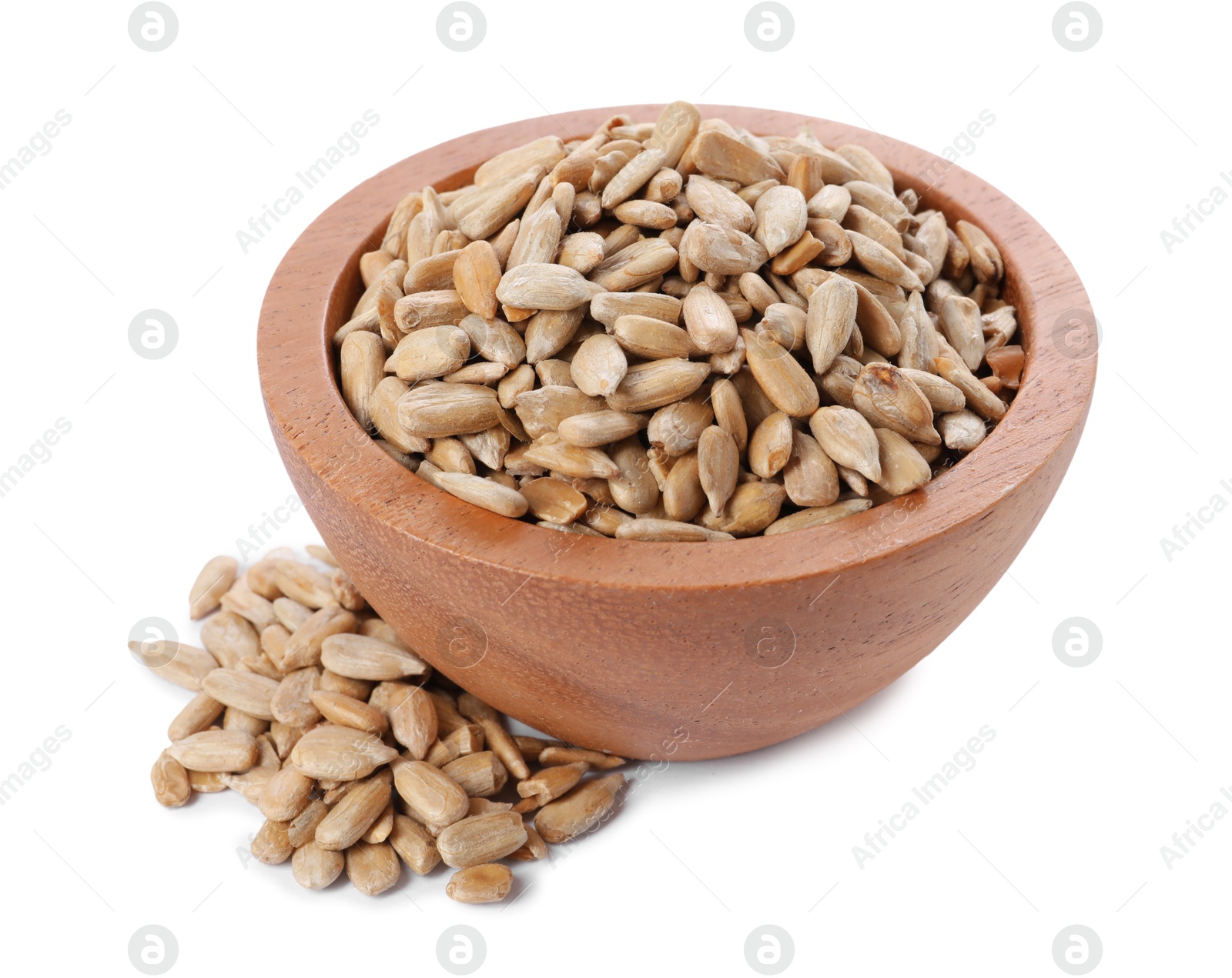 Photo of Peeled sunflower seeds in wooden bowl isolated on white