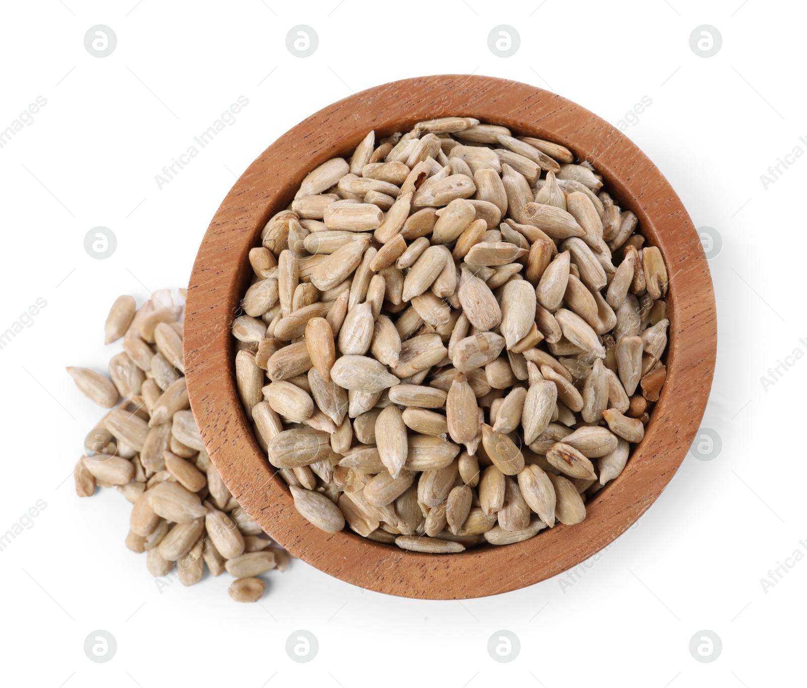 Photo of Peeled sunflower seeds in wooden bowl isolated on white, top view