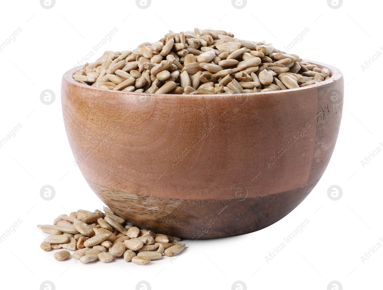 Photo of Peeled sunflower seeds in wooden bowl isolated on white