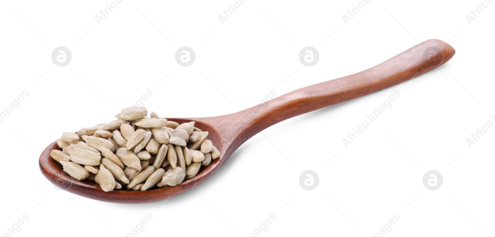 Photo of Peeled sunflower seeds in wooden spoon isolated on white